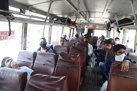 Inside of a bus with few passengers