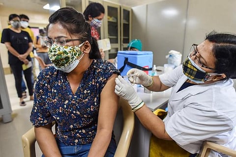A woman getting COVID-19 vaccine