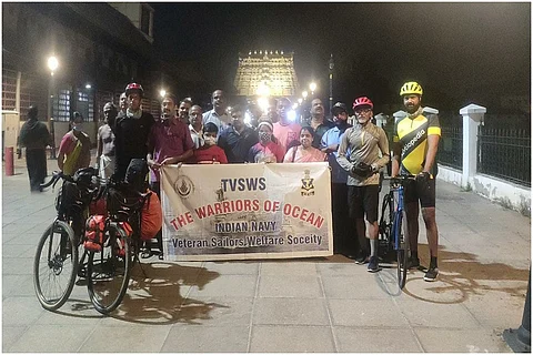 A groups of cyclists flagging of their cycling expedition