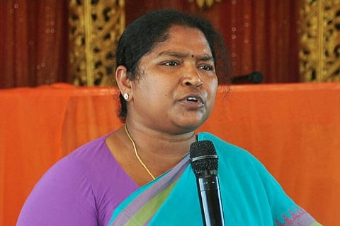 Mulugu MLA Danasari Seethakka speaking into a mic at an event