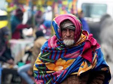 A representative picture of an old man in Delhi wrapped in shawl