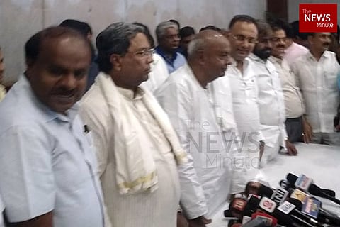 As K’taka ruling coalition conducts joint press meet, BJP asks where is Parameshwara?