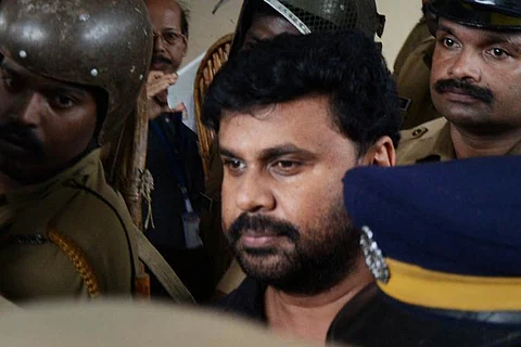 Actor Dileep with police personnel around him