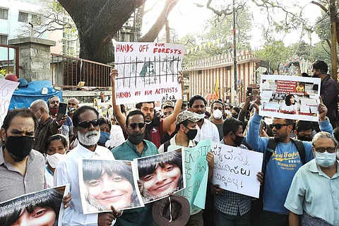 Protestors holding placards condemning the arrest of Disha Ravi
