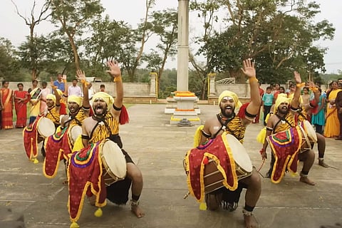 Group performing Dollu Kunitha in a scene from Kannada movie Dollu
