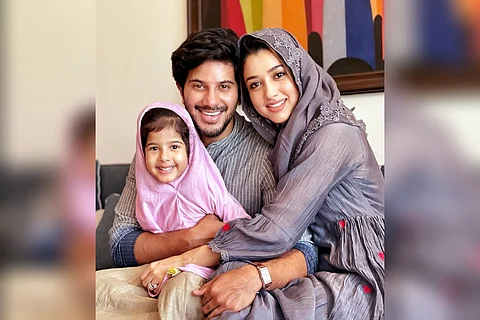 Dulquer Salmaan is seen along with his wife and daughter.