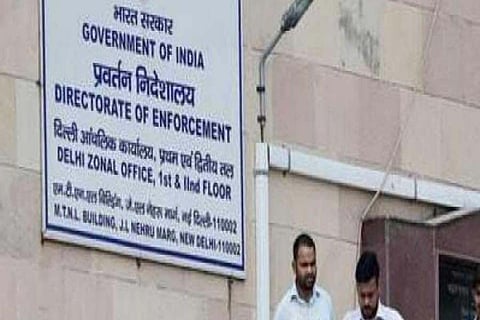 Two persons outside ED office in Delhi