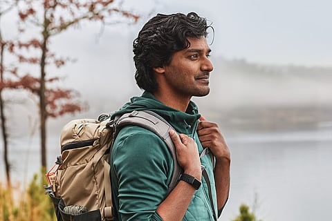 Person using Fitbit Charge 5 outdoors