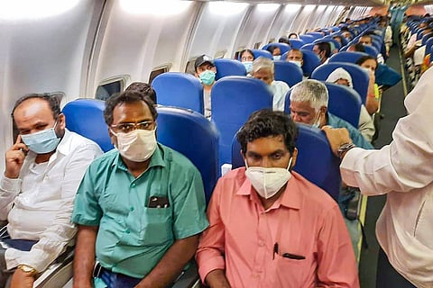 People wearing masks on a flight: DGCA asks airlines to take action against passengers not wearing masks