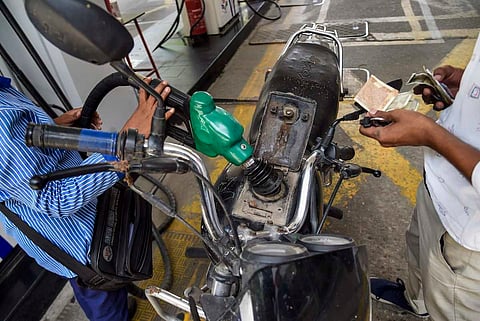 Petrol being filled in a bike