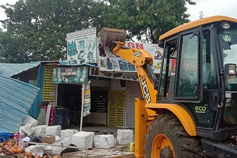 Officials carrying out demolition