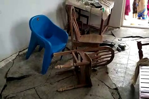 Cracks on floor due to rains in a 2BHK scheme house in Gajwel, Telangana