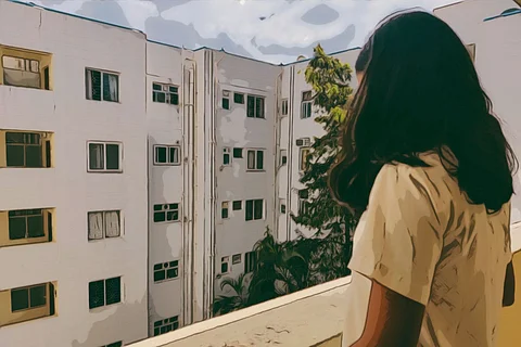 A representative image of a girl standing near a wall overlooking a building