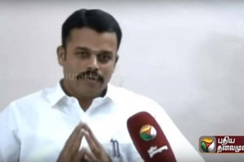 Yuvaraj, in a white shirt, giving an interview to Puthiya Thalaimurai channel