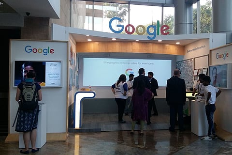 Google office lounge with employees standing around