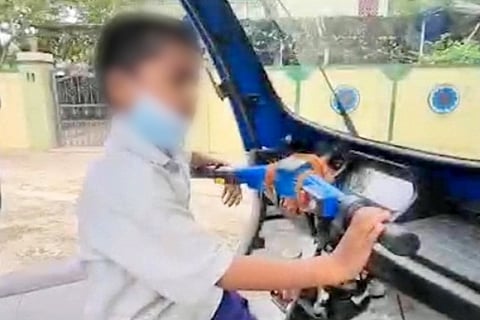 Eight year old Gopala Krishna driving an auto in his hometown in Andhra Pradesh