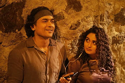 Suriya and Prayaga Martin in a still from Guitar Kambi Mele Nindru