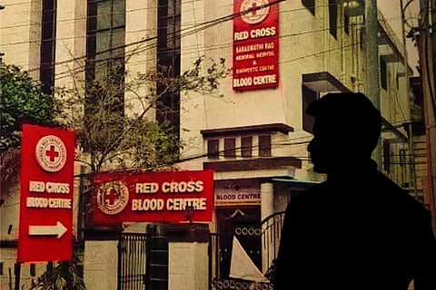 A photo of the blood bank and a silhouette of a man