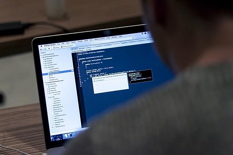 A person trying to hack a software