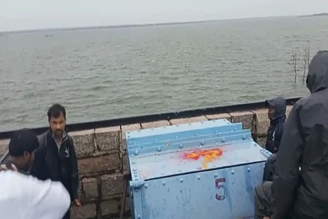 Officials lifting a gate at Himayat Sagar reservoir in Hyderabad