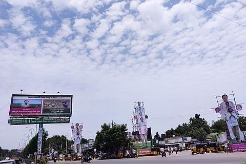 TRS party campaign hoardings at a main junction in Huzurabad town