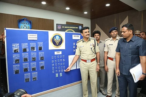 Hyderabad Police Commissioner showing narcotics seized in a drug bust