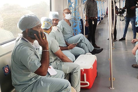 Doctors in Hyderabad Metro with heart being transported