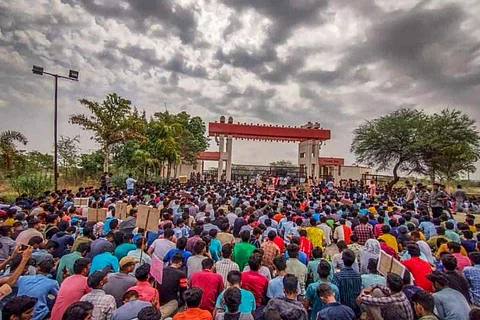 Hundreds of students sat on sit in protest at the entrance of the IIIT Basar campus.