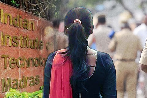 A woman facing the IIT-M gate