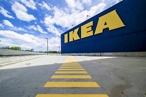 IKEA logo embossed on a blue building and a yellow zebra crossing in the foreground