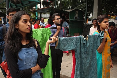 Bengaluru women march holding clothes they wore while they were sexually harassed