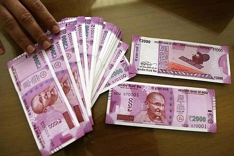 Rupee falls 14 paise to close at 82.35 against US dollar