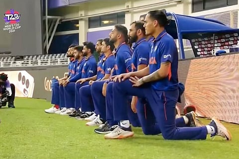 Indian players taking the knee before the match