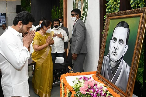 Andhra Pradesh Chief Minister Jagan folding hands in front of a portrait of Potti Sriramulu