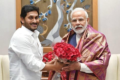 File photo of Jagan honouring Narendra Modi with a shawl and a bouquet