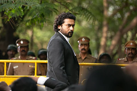 A screengrab from Tamil movie Jai Bhim showing Suriya in lawyer robes