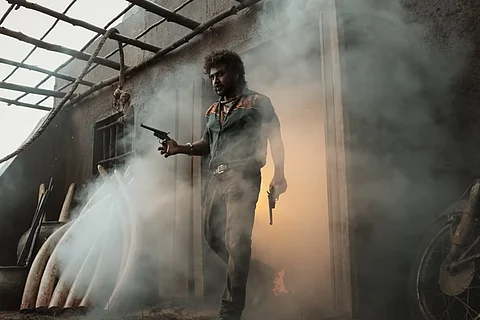 Raghava Lawrence wielding two pistols