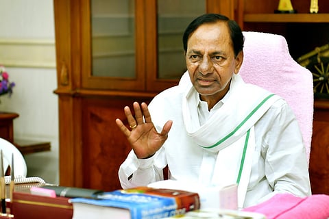 Telangana Chief Minister KCR seated at his desk