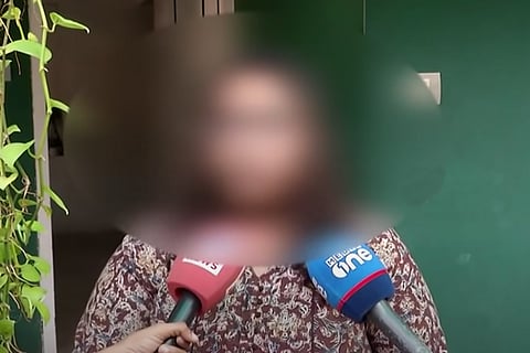 Kerala woman who was allegedly sexually harassed on a bus, with her face blurred