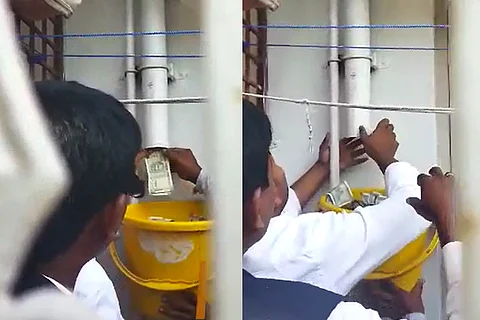 Screenshot from the video which shows cash seized from drain pipe in Kalaburagi