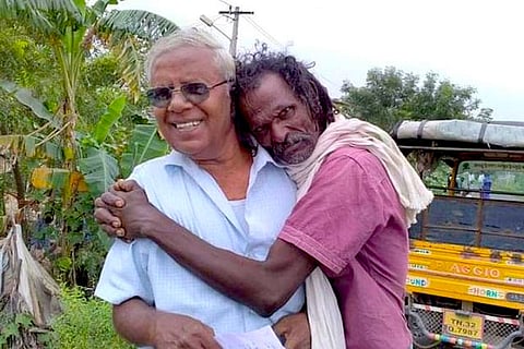 Activist Kalyani Thozhar being hugged by a Irular tribesman