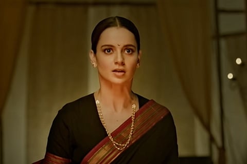 Kangana Ranaut wearing a saree, a screengrab from one of her movies