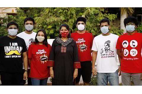 Kanimozhi with youngsters wearing anti-Hindi imposition tshirts