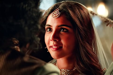 Kalyani Priyadarshan seen donning an ornate lehenga, dancing along with Pranav Mohanlal in the song 'Kannil Ente' from 'Marakkar: Arabikadalinte Simham'.