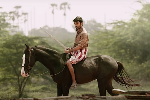 A screengrab with actor Dhanush sitting on a horse from movie Karnan teaser released on Tuesday