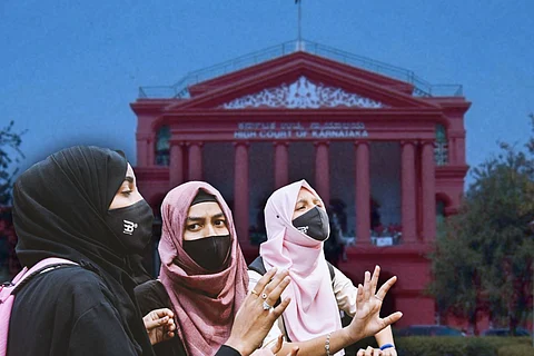 A picture of Muslim girl students wearing hijab, with Karnataka High Court in the background