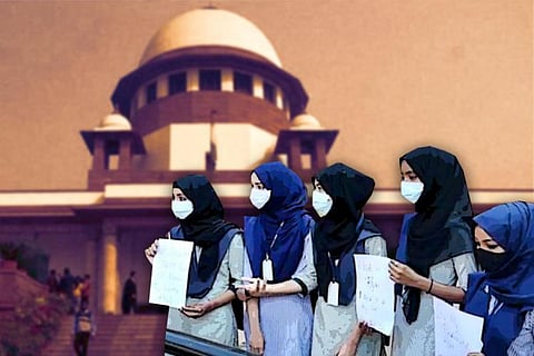 Students wearing hijab graphic in front of Supreme Court