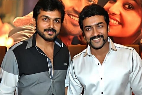 Actors Karthi and Suriya posing together for photo