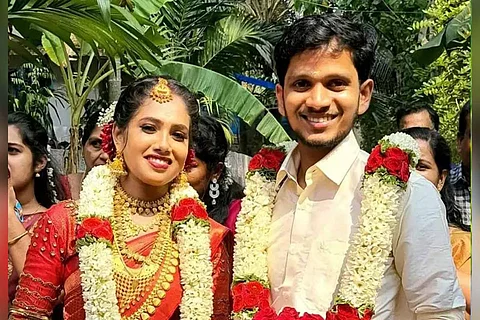 Regilal and his wife on their wedding day