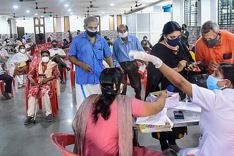Beneficiaries wait to get COVID-19 vaccine dose